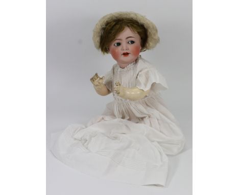A Simon & Halbig/K&R 126 bisque head baby doll, German circa 1915, with blue glass ‘flirty’ eyes, open mouth with two upper t