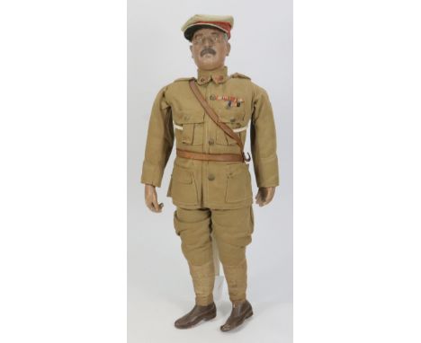 A rare Lord Kitchener propaganda composition doll, circa 1915, the moulded head with painted features, moustache, brown hair 