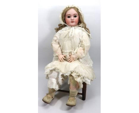 A large Simon & Halbig DEP bisque head girl doll, German circa 1910, with weighted brown glass eyes, real lashes, open mouth,
