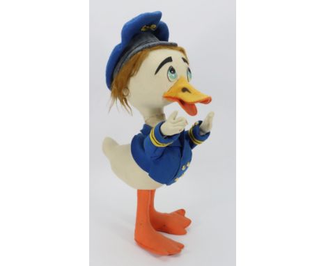 A large Lenci style felt Donald Duck soft toy,  the white and orange felt duck with celluloid eyes, wired beak, red hair and 