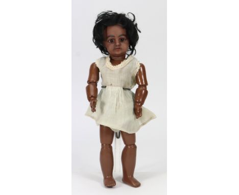 A small Simon and Halbig, black bisque head doll, size 2,  German circa 1910, with fixed brown glass eyes, open mouth, upper 