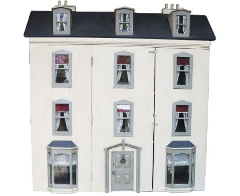 A large and impressive painted grey wooden dolls house and contents, English 1905, with large hinged and panelled front door,