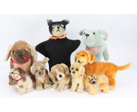 A collection of nine toy dogs, including Steiff ‘Peky’ mohair Pekingese with paper label, 3 ½” (9cm) tall, three various seat