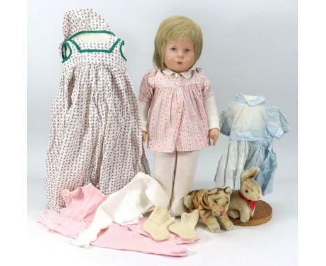 A Kathe Kruse doll in original clothes, German 1950s, the moulded synthetic head with painted features, short light brown hai