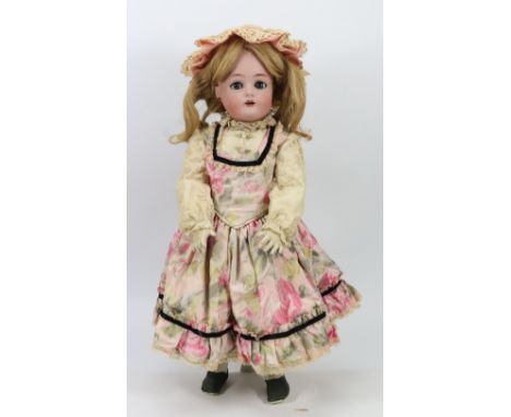 A Kammer & Reinhardt/S&H bisque head girl doll, German circa 1915, with weighted blue glass eyes, raised brows and open mouth