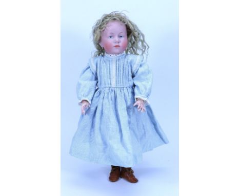 A Kammer & Reinhardt 101 bisque head character doll, German circa 1910, pale bisque head with painted light blue eyes, single