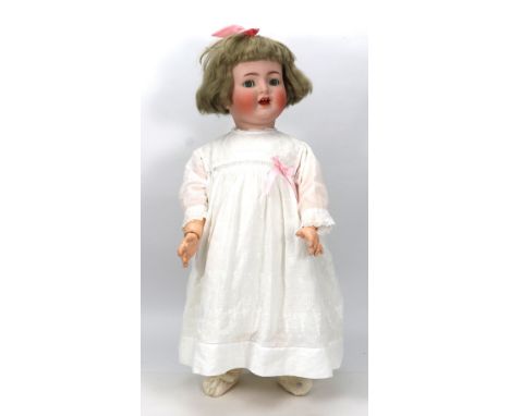 A large Kammer & Reinhardt 126 bisque head toddler doll, German circa 1915, with blue glass ‘flirty’ eyes, open mouth with tw