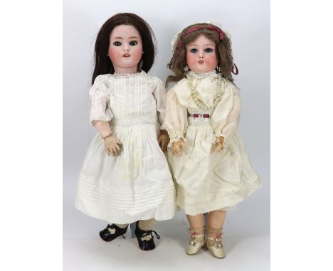 A Simon & Halbig bisque head doll, circa 1910, with weighted blue glass eyes, real lashes, open mouth with upper teeth, pierc