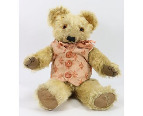 A Merrythought mohair Teddy bear, English circa 1930, golden mohair bear with orange glass eyes, black stitched nose, mouth a