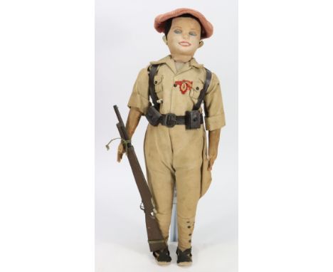A Spanish soldier and six Norah Welling’s cloth dolls, the soldier with painted features,  and brown cloth for hair, swivel h