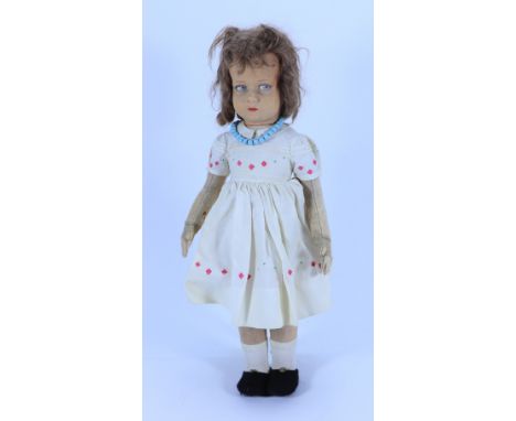 A Lenci cloth doll, Italian circa 1925, the moulded felt head with painted blue side glancing eyes, shaded mouth and auburn h