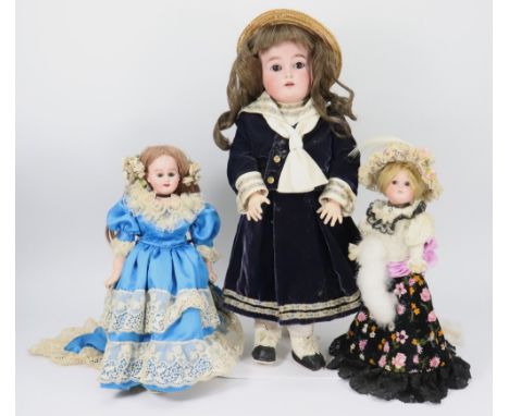 A Kammer & Reinhardt/S&H bisque head girl doll, German circa 1915, with weighted brown glass eyes, raised brows and  open mou