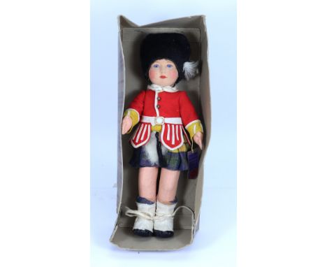 A Chad Valley ‘Jock’ Scottish guard cloth doll in original box, English 1920s, the felt face with blue glass eyes, painted la
