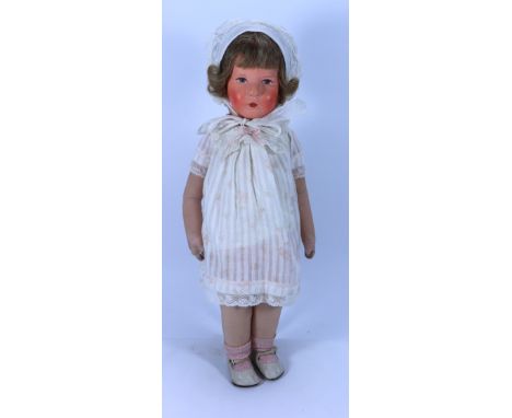 A Kathe Kruse cloth doll, VIII ‘German Child’ German circa 1929, the moulded hollow head with painted features, brown hair, s