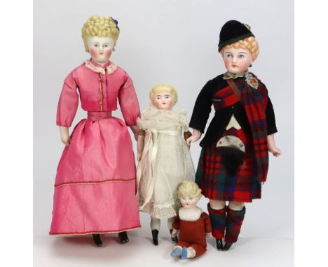 A Parian-type shoulder head doll in original Scottish clothes, circa 1890, with painted features, moulded blonde hair and on 