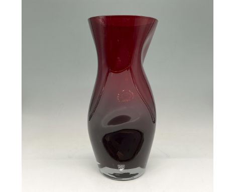 Rounded sensuous lines with clear weighted base. Orrefors backstamp. This item has its original box: 6.5"L x 12"W x 6.5"H. Ar
