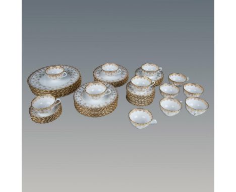 White with gold fleur-de-lis trims. Includes 8 dinner plates (1"H x 10.75" dia.); 7 salad plates (0.75"H x 8" dia.); 8 soup b