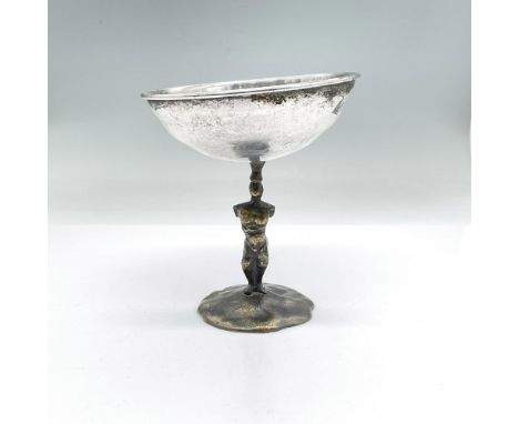 Unusual goblet with a bronze base of an abstract man with no arms or facial features and a silver top. Artist signed. Dimensi