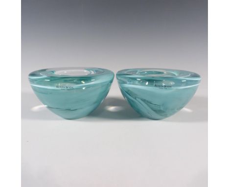 A set of two clear round votive candle holders with light ocean green-blue swirls. Kosta Boda marked. Artist: Anna EhrnerDime