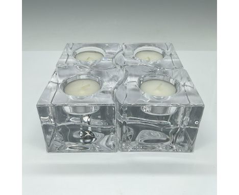 Unique and playful crystal candle holders designed in the shape of puzzle pieces, cleverly fitting together to form a charmin