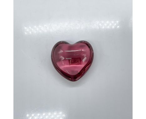 Light red crystal heart paperweight. Baccarat etched mark. Dimensions: 3"L x 3"W x 1.75"HManufacturer: BaccaratCountry of Ori