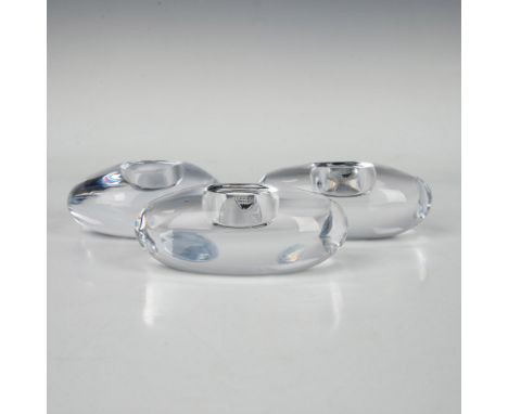 3 smooth oblong candleholders, reminiscent of polished stones, each featuring a center candle hole for a tranquil glow. Marke