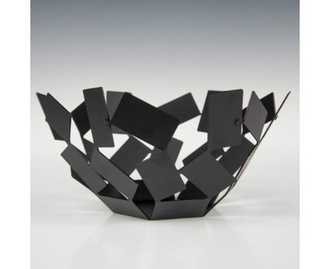 A black steel bowl, showcasing a hexagonal base and artistic arms constructed from interconnected rectangles. Marked Alessi. 