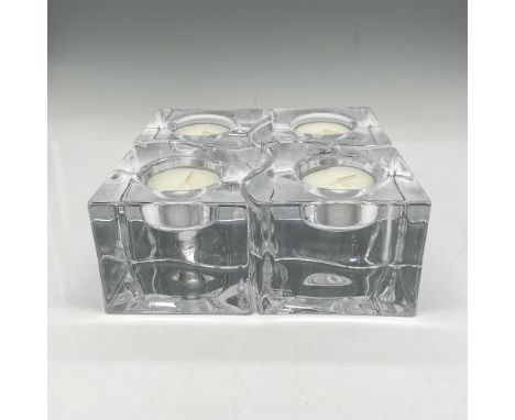 Four-piece clear crystal holders that fit together but can be used separately. Unique design for any table. Orrefors mark. Th