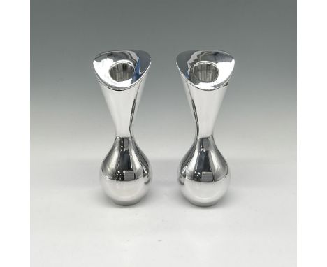 Silver toned metal holder in hourglass shape can play a dual role and is a nice touch for any occasion. Nambe mark. This item