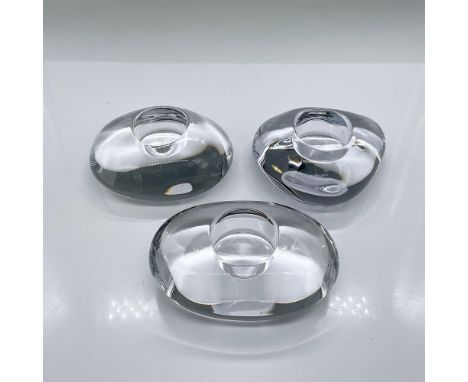 Three clear crystal candle holders in the shapes of rounded triangle, oval and long oval. Orrefors mark. The long oval is 2"H