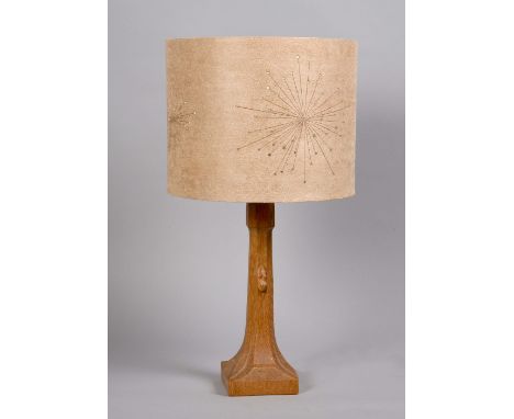 A Mouseman carved oak table lamp with a shade, the lamp 10in h, with shade 18.5in h.