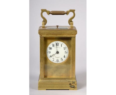 A late19c French carriage clock in glazed brass case with fluted rectangular corners and horizontal ribbing above and below t
