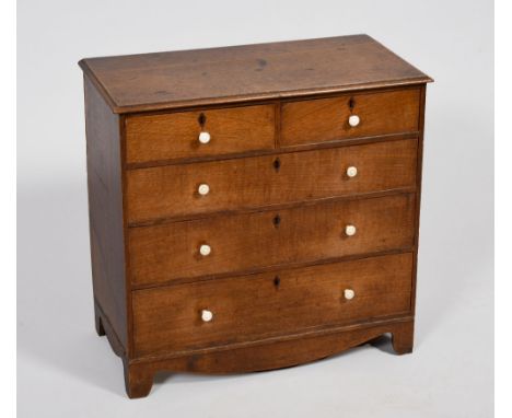A late Georgian oak apprentice chest of two short and three long graduated drawers, on bracket feet, 19in w, 18in h.