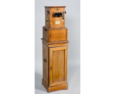 An early 20c Le Taxiphote Stereo - Classeur. The mahogany constructed glass slide viewer is accompanied by approximately 700 