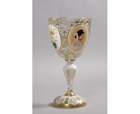 A 19c Bohemian bowl on stand with leaf cut rim, decorated with raised opalene glass roundels, painted with bouquets of flower