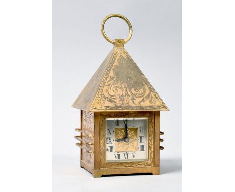 An early 20c French mantel clock, the brass case in the form of a lantern with pitched rectangular roof with hanging loop. Th