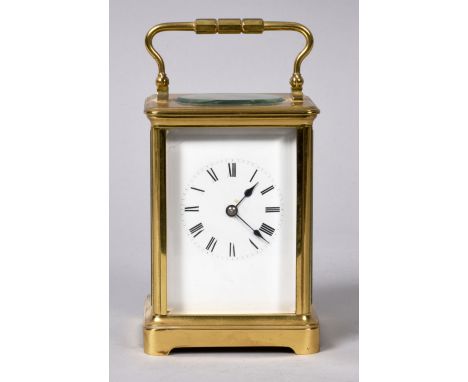 A late 19c French carriage clock in glazed brass 'Corniche' style case. The rectangular white enamel dial has Roman numerals 