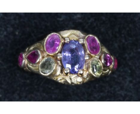 A gold 22ct gents ring set with rubys and multi coloured sapphires, gemologists report in office.