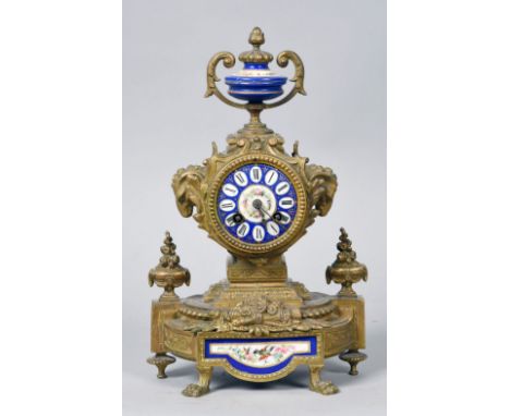 A late 19c French mantel clock in gilt spelter case with Paris porcelain blue ground dial and having a blue ground porcelain 