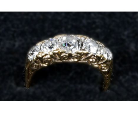 An 18ct gold ring set with five cut graduating diamonds, approx. 1.5ct total.