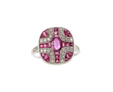 RUBY, SPINEL AND DIAMOND RING, set with an oval ruby bordered by calibre cut rubies and spinels and round brilliant cut diamo