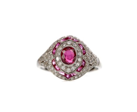 RUBY AND DIAMOND RING, set with a central ruby of approximately 0.65 carats with round brilliant cut diamonds and calibre cut