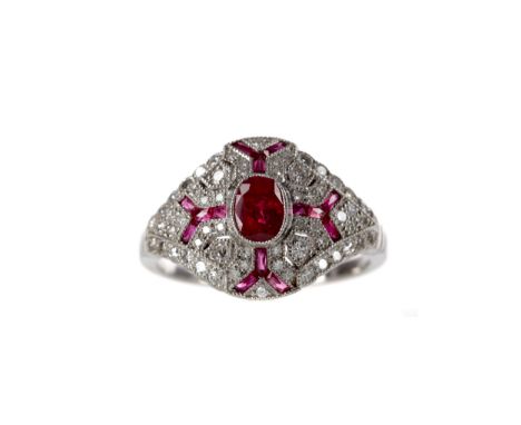 RUBY AND DIAMOND RING, with central oval ruby with radiating ruby sections, surrounded by round brilliant cut diamonds, unmar