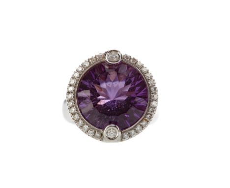 AMETHYST AND DIAMOND RING, set with a round amethyst of approximately 10.00 carats within a halo of round brilliant cut diamo