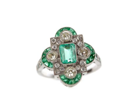 EMERALD AND DIAMOND RING, the central emerald cut emerald flanked by round brilliant cut diamonds totalling approximately 0.6