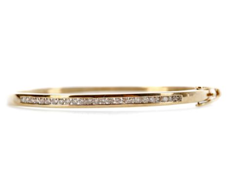 DIAMOND BANGLE, set with round brilliant cut diamonds totalling approximately 1.00 carat, 62mm inner diameter, in nine carat 