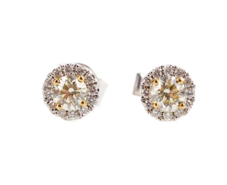 PAIR OF DIAMOND CLUSTER EARRINGS, set with a central round brilliant cut light yellow diamond within a colourless diamond hal