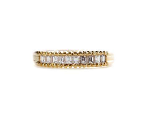 DIAMOND HALF ETERNITY RING, set with step cut diamonds of approximately 0.50 carats, marked 18C, size P 1/2, 3.7g