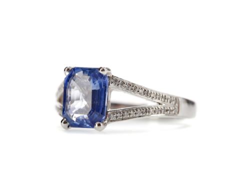 SAPPHIRE AND DIAMOND RING, set with a step cut sapphire of approximately 1.89 carats, on diamond set bifurcated shoulders, th