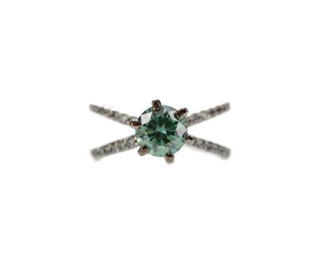 BLUE MOISSANITE RING, set with an oval blue moissanite, to a gem set bifurcated shank, unmarked, likely silver, size M, 4g